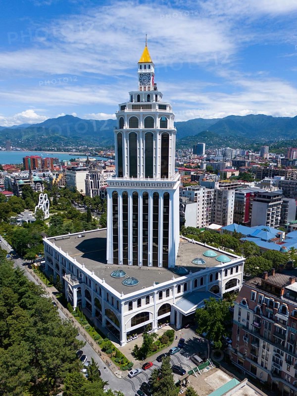 A tall modern building in an urban environment with mountains, aerial view, Sheraton Hotel, Batumi, Black Sea, Adjara region, Adjara, Autonomous Republic of Georgia