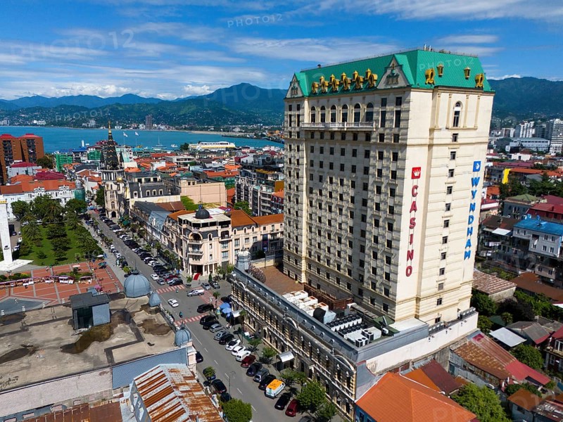 Large hotel building in a coastal town with mountains in the background and lively street scene, aerial view, Princess Casino, Batumi, Black Sea, Adjara region, Adjara, autonomous republic, Georgia