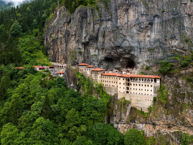 A monastery embedded in a green rocky landscape surrounded by dense forest, aerial view, Sumela Monastery, Sümela Manastiri, Maçka, Macka, Trabzon Province, Turkey