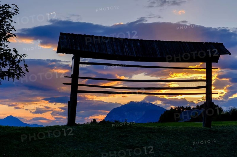 Sunset, hayrack, hayrack, at the ruins of Finkenstein Castle, on Lake Faak, Carinthia, Austria