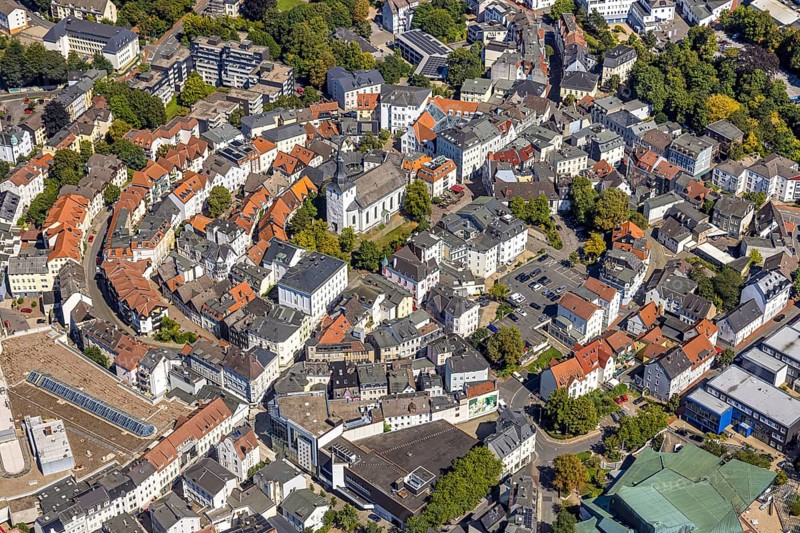 Aerial view, circular residential complex in the city centre with evang. Erlöserkirche, Corneliusstrasse and Grabenstrasse, Lüdenscheid city, Lüdenscheid, Sauerland, North Rhine-Westphalia, Germany, place of worship, DE, Europe, religious community, place of worship, property tax, holy place, real estate, church, parish, denomination, aerial view, aerial photography, aerial photography, Märkischer Kreis, religion, religious site, overview, bird's-eye view, residential area, living and life, residential area, quality of life, residential neighbourhood, housing estate, residential district, birds-eyes view, overview