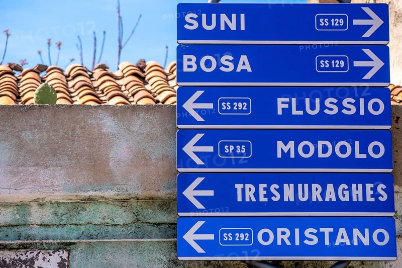 Sardinia, road signposts to places, Tinnura, Europe, Province of Oristano, Italy, architecture, outdoor, signposting, village, distances, area, signpost, identity, information, culture, landmark, navigation, orientation, places, place name sign, region, travel, direction, sign, sightseeing, location, road, road signpost, tourism, environment, traffic, signpost, destination, Italian, rural, Mediterranean, touristic, typical, public