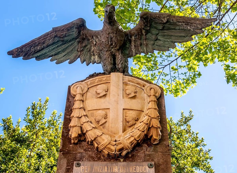 Sardinia, eagle and national flag in stone, Per iniziativa del Reduci, Santu Lussurgiu, Europe, Province of Oristano, Italy, eagle, architecture, outdoor, preservation, monument, heritage, memory, flag, memorial, history, identity, insignia, culture, art, national flag, place, perspective, politics, relief, sightseeing, sculpture, stone, symbolism, daylight, tourism, tradition, bird, landmark, Italian, rural, national, regional, stone, public