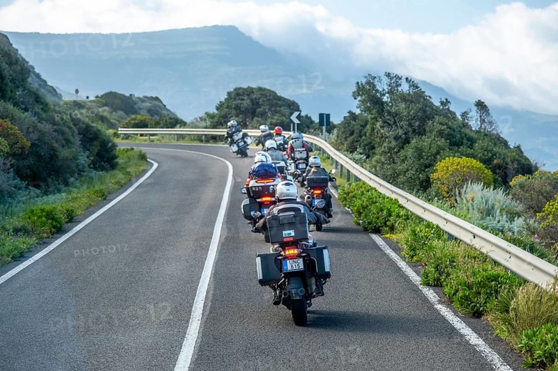 Sardinia, biker motorcyclist on the mountainous coastal road, Villanova Monteleone, Europe, Province of Sassari, Italy, adventure, asphalt, view, mountains, movement, biker, discovery, driving fun, ride, vehicle, freedom, speed, helmet, sky, curves, coast, landscape, sea view, Mediterranean, motorcyclist, male, nature, outdoor, travel, protective clothing, sightseeing, sport, road, daylight, tourism, environment, mountainous coastal road, adult, rural
