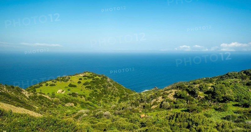 Sardinia, Mountainous coastal landscape by the sea, blue sky with clouds, Bosa, Europe, Province of Oristano, Italy, View, Mountains, Mountainous, Recreation, Exploration, Rocks, Geography, Sky, Hills, Idyllic, Coast, Coastal landscape, Landform, Sea, Nature, Panorama, Destination, Sightseeing, Scenic, Tourism, Shore, Holiday, Water, Clouds, Blue sky, European, Scenic, Picturesque, Mediterranean