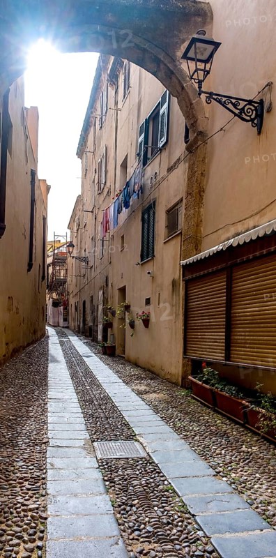 Sardinia, Narrow cobblestone alley and houses in the old town, Laundry by the window, Alghero, Europe, Province of Sassari, Italy, old building, old town, architecture, atmosphere, balconies, narrow alley, exploration, window, shutters, alley, building, houses, Idyllic, cobblestone, culture, travel, destination, sight, sightseeing, city, city life, alleyway, tourism, urban, neighbourhood, laundry, foreign, authentic, charming, narrow, historic, picturesque, Mediterranean, square, traditional
