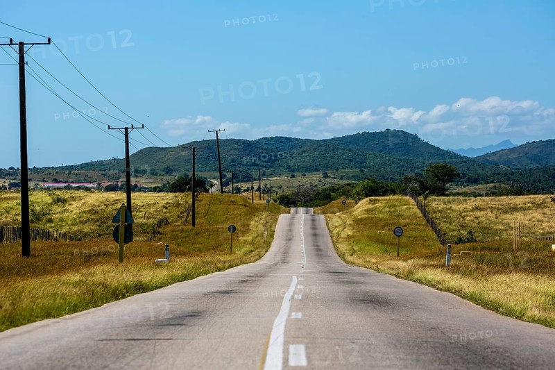 Country road between Santa Clara and Trinidad Valley of Ingenios, Valle de los Ingenios, country road with central reservation, Valle Ingenios, Cuba, Central America