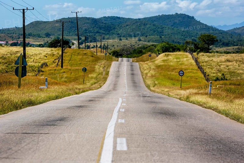 Country road between Santa Clara and Trinidad Valley of Ingenios, Valle de los Ingenios, country road with central reservation, Valle Ingenios, Cuba, Central America