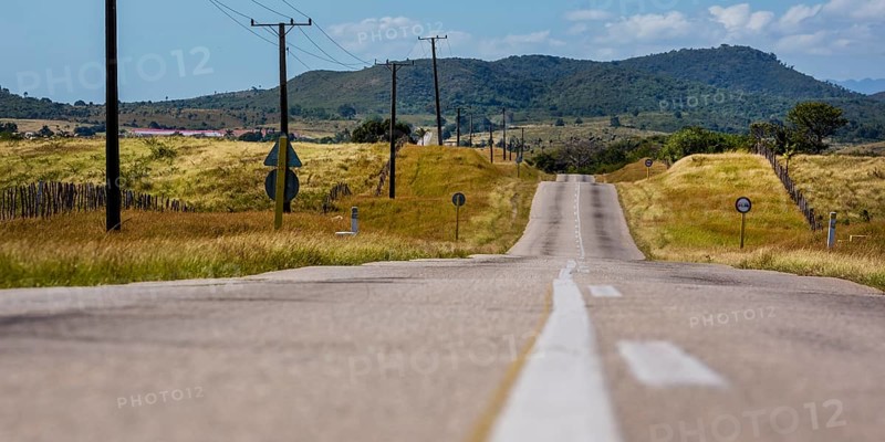 Country road between Santa Clara and Trinidad Valley of Ingenios, Valle de los Ingenios, country road with central reservation, Valle Ingenios, Cuba, Central America