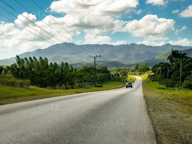 Country road between Santa Clara and Trinidad Valley of Ingenios, Valle de los Ingenios, country road with central reservation, Valle Ingenios, Cuba, Central America