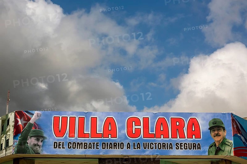 Comandante Fidel Castro on a poster in the city centre, Streetlife in the city centre of Santa Clara at the Parque de Santa Clara, Santa Clara, Cuba, Villa Clara