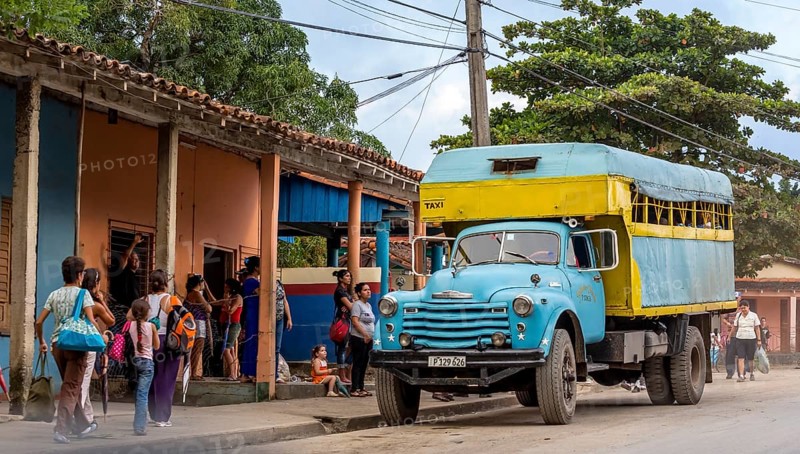 Bus stop and lorry for passenger transport, bus, public transport, local public transport, lorry in yellow and turquoise, Viñales, Cuba, Pinar del RÃo