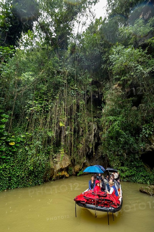 Exit of the cave system, tourists in an electric boat with life jackets, caves of the Indios, Cueva del Indio, underground caves with a watercourse river accessible to tourists, Viñales, Cuba, Central America, Cuba, Caribbean