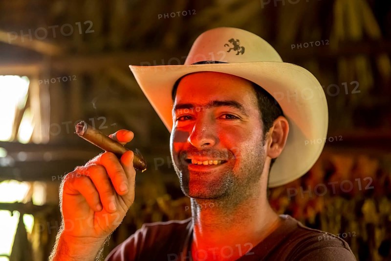 Tobacco farmer, tobacco farmer Luis Manne Alvares Rodrigues smokes a Havana cigar, tobacco farm in the Vinales Valley, Viñales, Cuba, Pinar del Río, Viñales, Pinar del Río