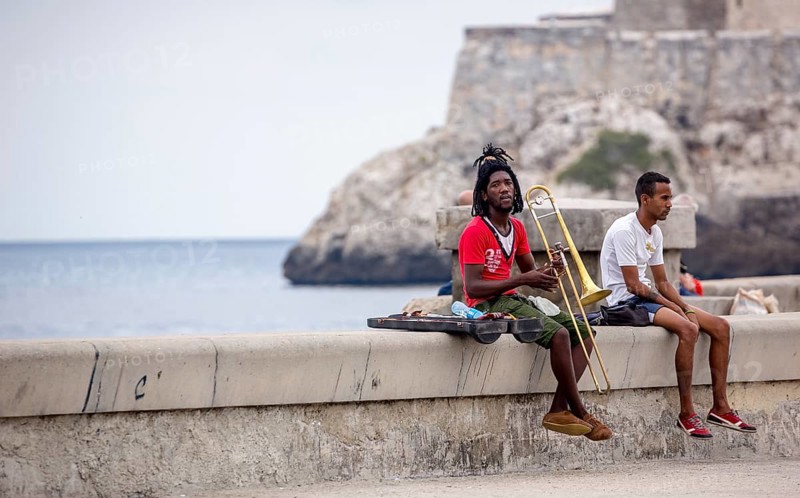 Young Cubans on the walls of the Malecon trombonist, musicians outdoors with dreadlocks, La Habana, Havana, Cuba, Cuba, Europe, aerial view, birds-eyes view, aerial photography, aerial photography, overview, bird's eye view