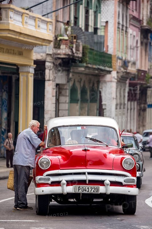 Red and white vintage car in street scene, Old American street cruiser on the streets of Havana, Taxi, La Habana, Havana, Cuba, Cuba, Europe, aerial view, birds-eyes view, aerial photography, aerial photography, aerial photography, overview, bird's eye view