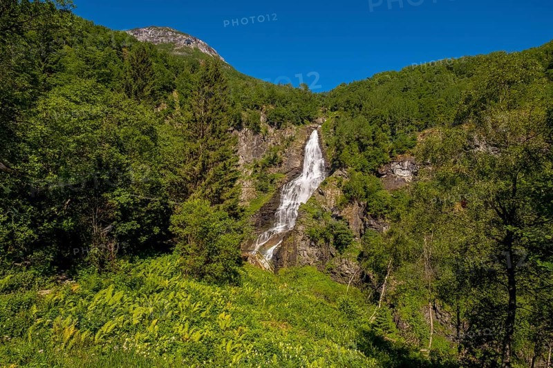 Waterfall near Stahlheim, mountains, baür sky, Skulestadmo, Hordaland, Norway, Scandinavia, Europe, Stalheim, NOR, travel, tourism, destination, sightseeing, sea voyage, Hurtigruten, Hurtigruten trip, tourism, Norwegian, Scandinavian, tourist, cruise, adventure trip, landscape, trees, forest, forestry, agriculture, water, valley, meadows, houses