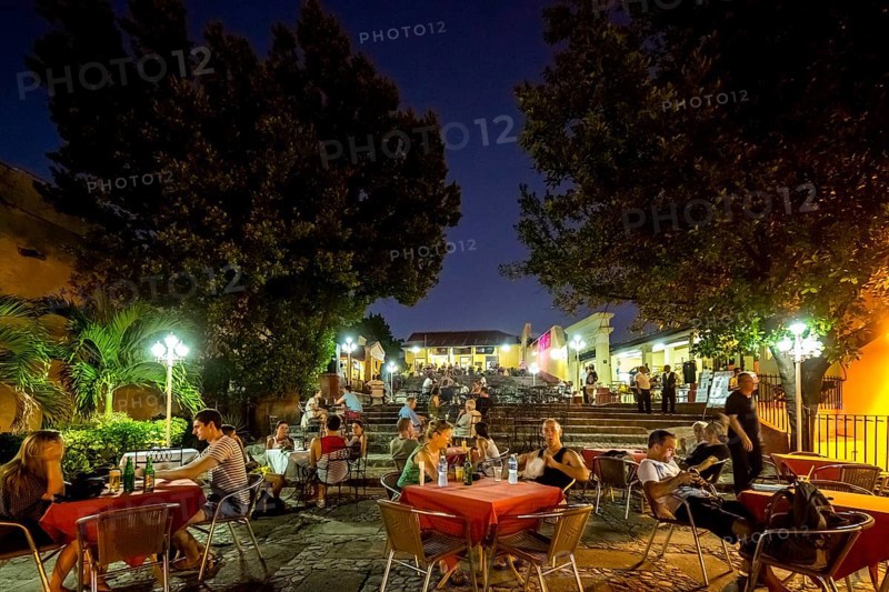 Restaurant and pub in the old town of Trinidad with visitors at the blue hour, tourists at tables, Trinidad, Cuba, Sancti Spíritus, Cuba, Sancti Spíritus