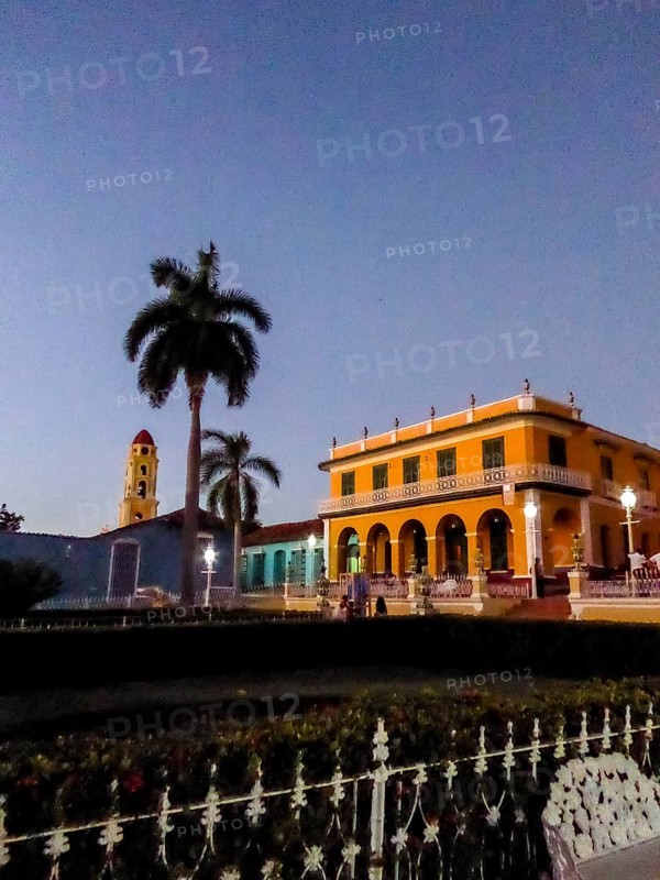 Centre of Trinidad Palacio Brunet, yellow palace with blue sky and the church Convento de San Francisco de Asis, Trinidad, Cuba, Sancti Spíritus, Cuba