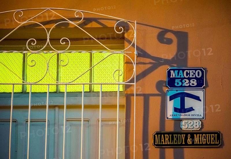 Street signs with the indication of a private accommodation for tourists of a Casa Paricular, street scene in the old town of Trinidad, Trinidad, Cuba, Sancti Spíritus, Cuba, Sancti Spíritus