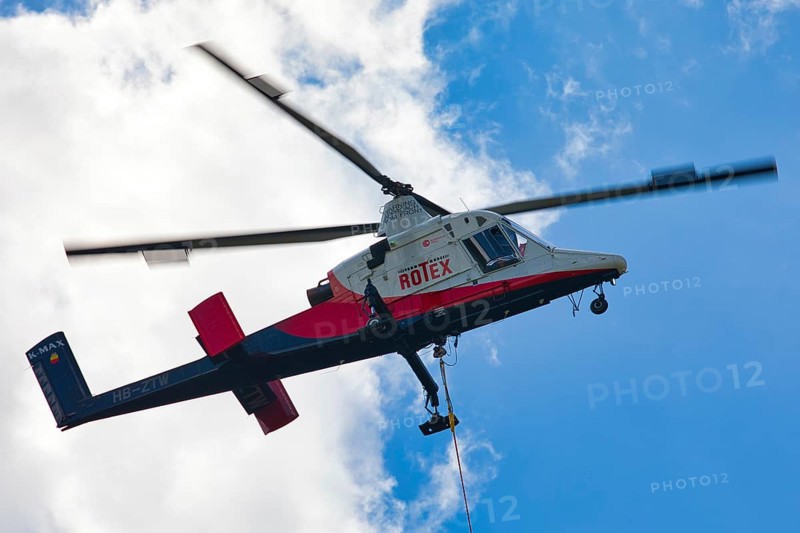 Detailed view of a helicopter with Rotex logo in the sky, transport helicopter, timber transport, Saas Grund, Canton Valais, Switzerland