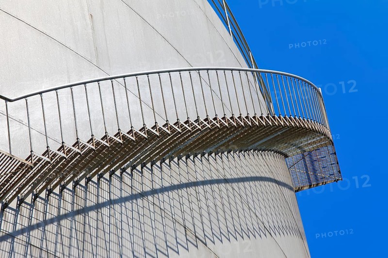 The staircase runs along a large tank in front of a clear blue sky, high tank, chemical, company, Grenzach- Wyhlen, Baden-Württemberg, Germany