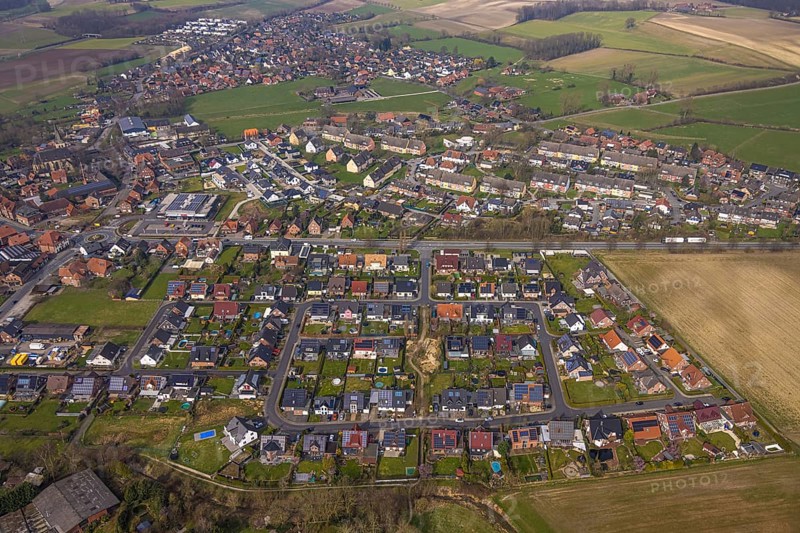 Aerial view, residential area local view district Dolberg, new REWE supermarket with solar roof, wind turbines, new roundabout Alleestraße and Uentroper Straße, new residential area Hases Wiese, Ahlen, Dolberg, Ruhr area, Germany, residential area, local view, district, REWE supermarket, solar roof, roundabout, Alleestraße, Uentroper Straße, new development, Hases Wiese, shopping, renewable energy, transport, roads, infrastructure, development, housing, urban planning, environmental protection, architecture, urban planning, suburban, development area, sustainability, green energy, urban, landscape, technology, innovation, community, energy efficiency