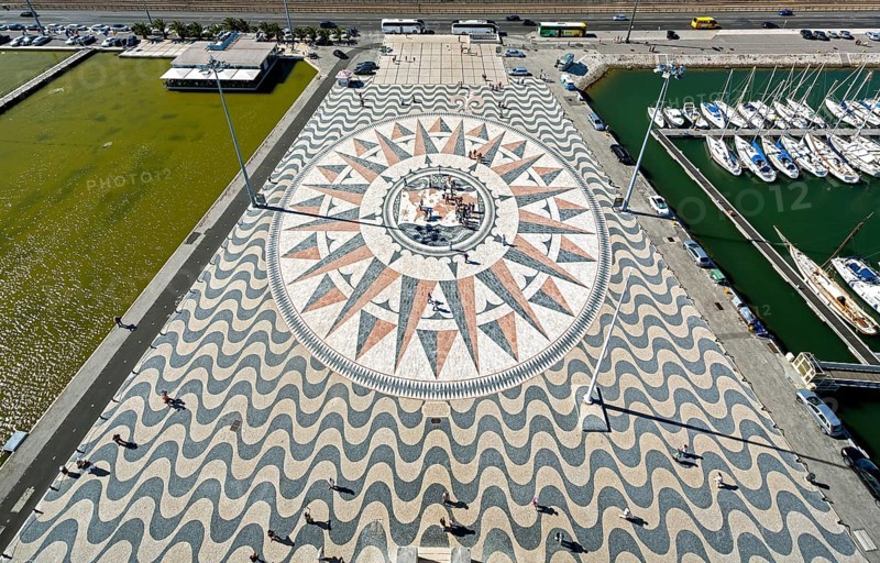 The large compass in the wave pavement in front of the Monumento a Los Descubrimientos, Lisbon, District of Lisbon, Portugal