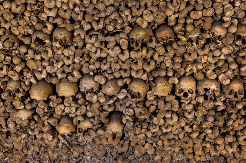 Piled bones in the ossuary, Capela dos ossos parede, chapel of bones, bone chapel, ossuary in Évora, Evora, district of Évora, Portugal