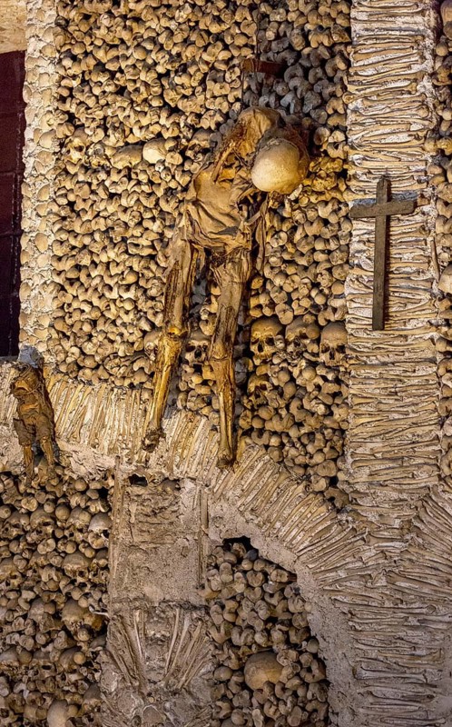 Piled bones in the ossuary, Capela dos ossos parede, chapel of bones, bone chapel, ossuary in Évora, Evora, district of Évora, Portugal