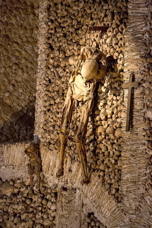 Piled bones in the ossuary, Capela dos ossos parede, chapel of bones, bone chapel, ossuary in Évora, Evora, district of Évora, Portugal