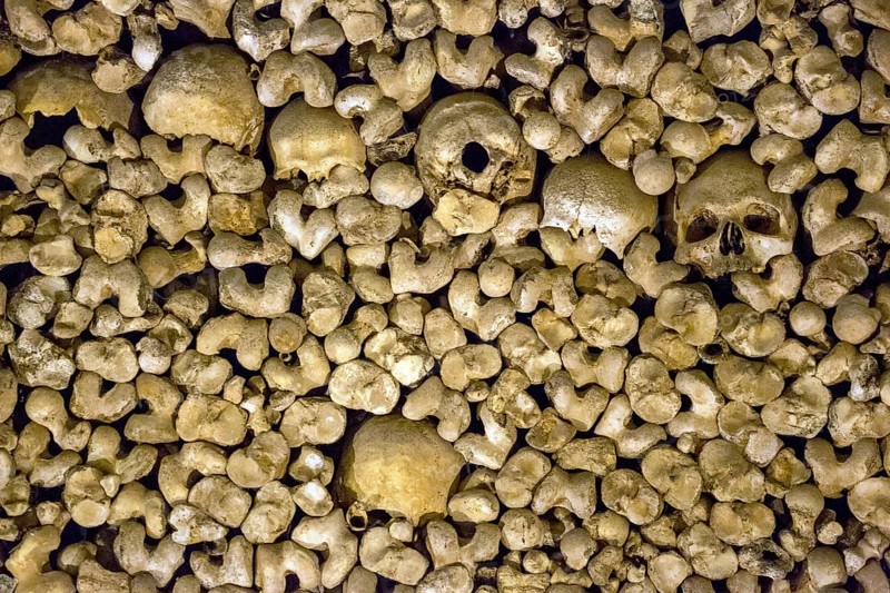 Piled bones in the ossuary, Capela dos ossos parede, chapel of bones, bone chapel, ossuary in Évora, Evora, district of Évora, Portugal
