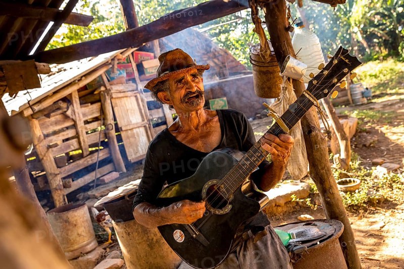 Sugar cane farmer in Valle de los Ingenios plays guitar for the tourists, Trinidad, Cuba, Sancti Spíritus, Cuba, Sancti Spíritus