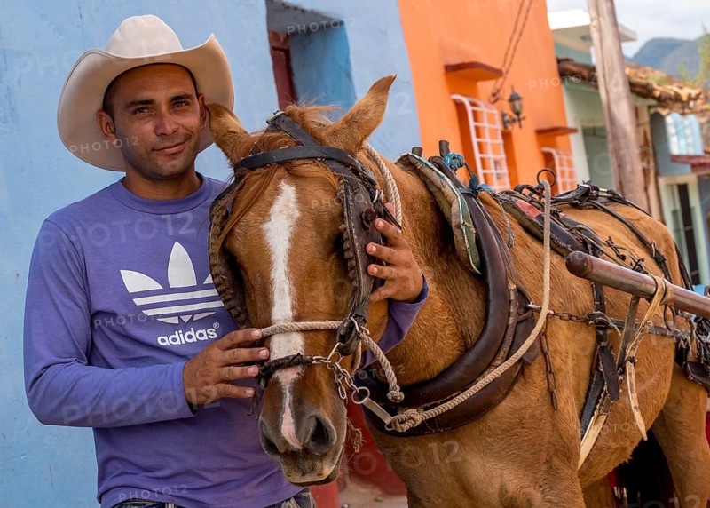 Cuban rider cowboy with his horse in the streets of Trinidad, Trinidad, Cuba, Sancti Spíritus, Cuba, Sancti Spíritus