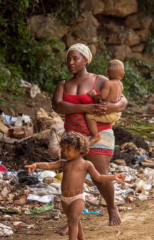 Mother with two children barefoot at a rubbish dump, poverty on the island of Cuba, Trinidad, Cuba, Sancti Spíritus, Cuba, Sancti Spíritus