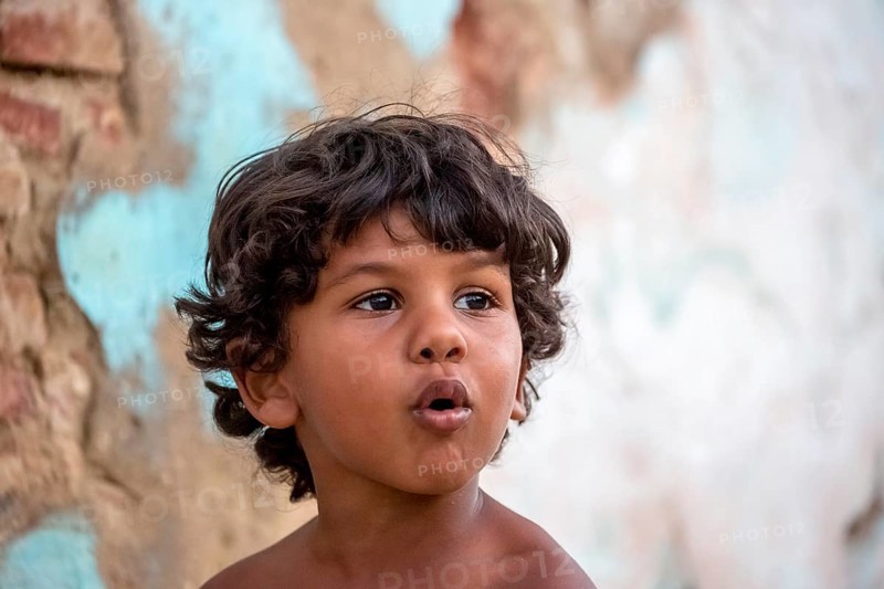 Little Cuban boy on the street in front of an old wall, Street scene in the old town of Trinidad, Trinidad, Cuba, Sancti Spíritus, Cuba, Sancti Spíritus
