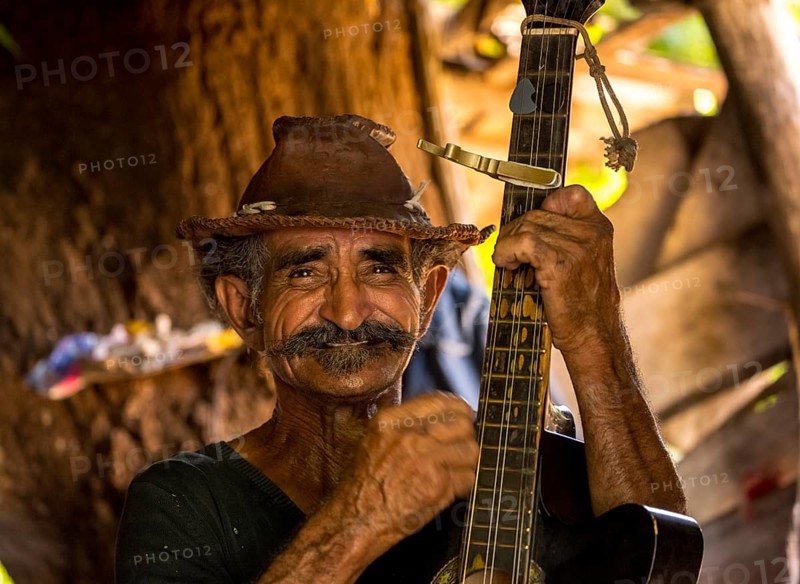 Sugar cane farmer in Valle de los Ingenios plays guitar for the tourists, Trinidad, Cuba, Sancti Spíritus, Cuba, Sancti Spíritus