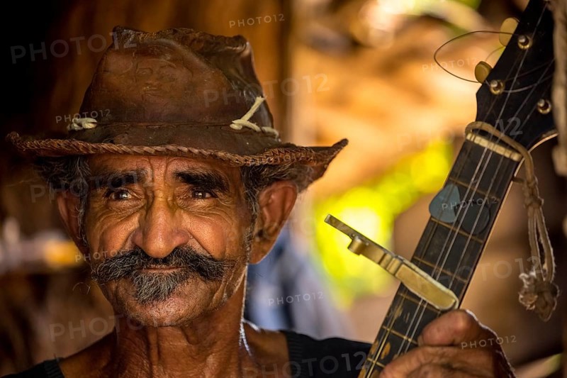 Sugar cane farmer in Valle de los Ingenios plays guitar for the tourists, Trinidad, Cuba, Sancti Spíritus, Cuba, Sancti Spíritus
