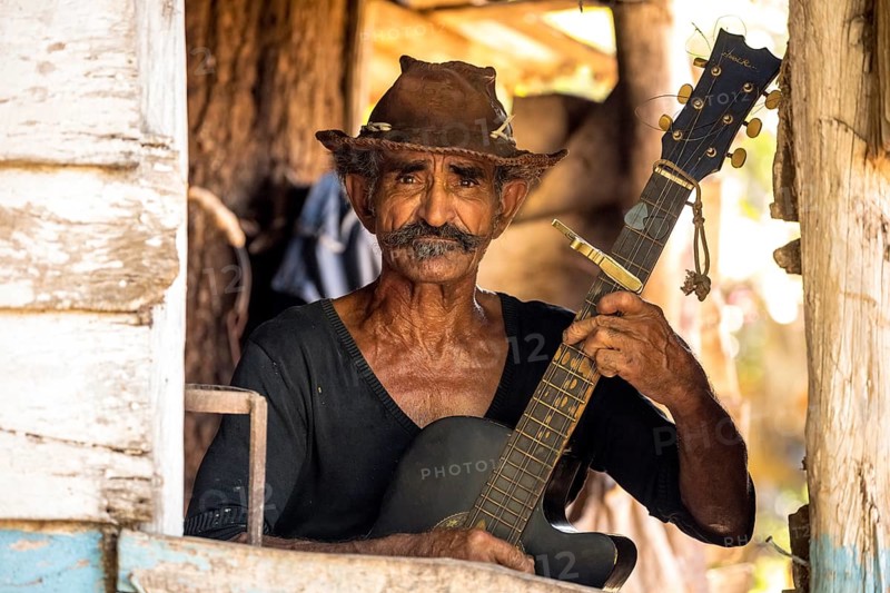 Sugar cane farmer in Valle de los Ingenios plays guitar for the tourists, Trinidad, Cuba, Sancti Spíritus, Cuba, Sancti Spíritus