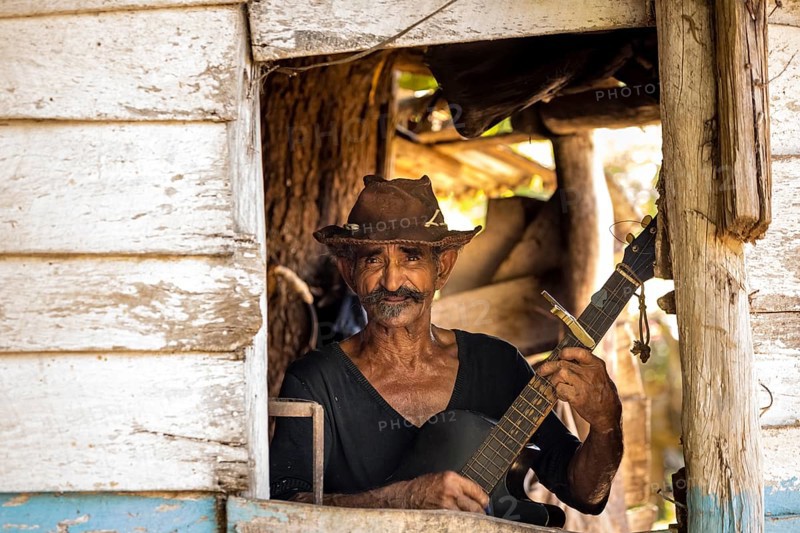 Sugar cane farmer in Valle de los Ingenios plays guitar for the tourists, Trinidad, Cuba, Sancti Spíritus, Cuba, Sancti Spíritus