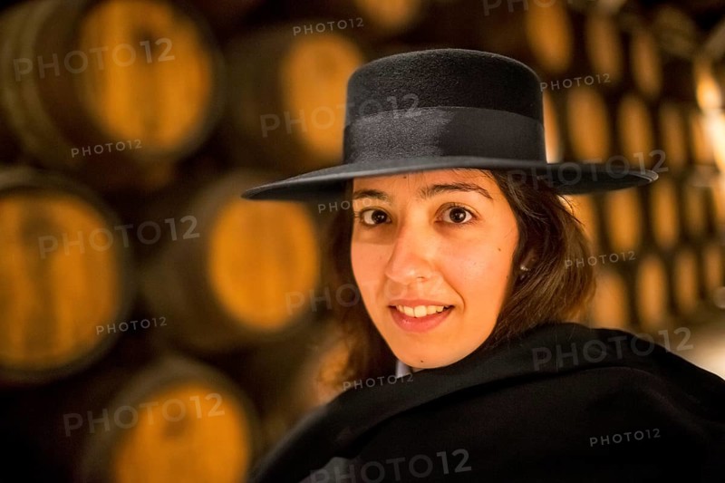 Classic travel guide with student robe, zorro hat and cape, port wine barrels, wine cellar of the Sandemann winery in Gaia, Porto, Vila Nova de Gaia, Porto district, Portugal, Europe, aerial view, birds-eyes view, Travel, travel photography