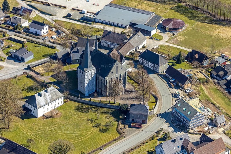 Aerial view, construction work on the steeple of St. Martinus Church, behind riding centre Hellefeld, Hellefeld, Sundern, Sauerland, North Rhine-Westphalia, Germany, place of worship, construction work, construction area, construction site, construction measure, construction project, construction site, DE, Europe, religious community, place of worship, holy place, church, parish, denomination, aerial view, aerial photography, aerial photography, equestrian sport, equestrian centre, equestrian sport, equestrian centre, riding stable, riding club, religion, religious site, overview, bird's-eye view, overview
