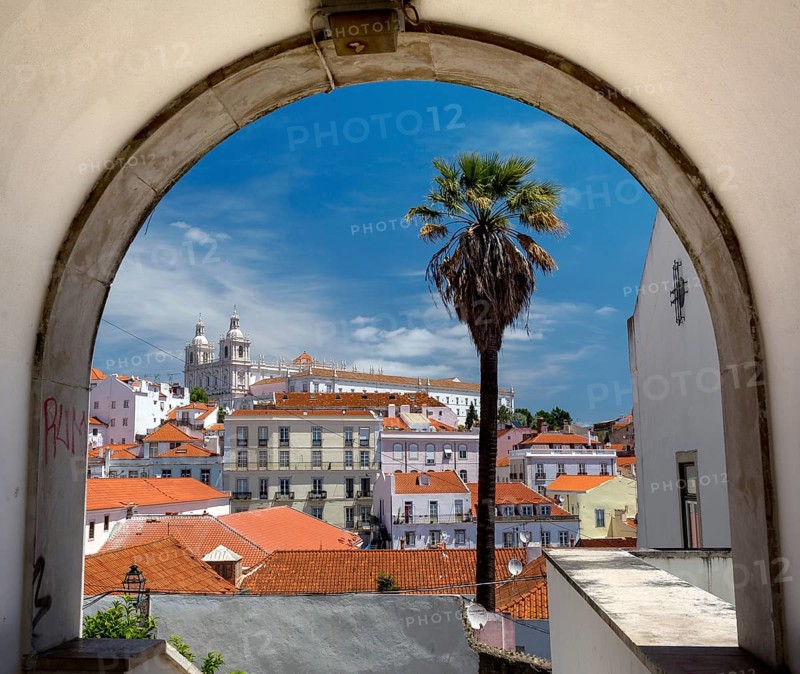 View over the red roofs and through an archway of Lisbon to the Cathedral SÃ©, Lisbon, Lisbon district, Portugal, Europe, aerial view, birds-eyes view, Travel, Travel Photography
