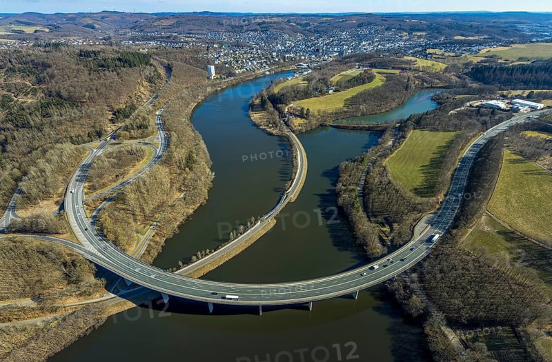 Aerial view, Biggesee with forest area, Obersee with bridge Landesstraße L512, curved bridge Bundesstraße B54, Olpe-Stadt, Olpe, Sauerland, North Rhine-Westphalia, Germany, Biggetalsperre, bridge, Bundesstraße B54, DE, Europe, shapes and colours, hilly landscape, aerial view, aerial photography, aerial photography, nature park Ebbegebirge, lake, reservoir, overview, bird's eye view, forebay, birds-eyes view, overview