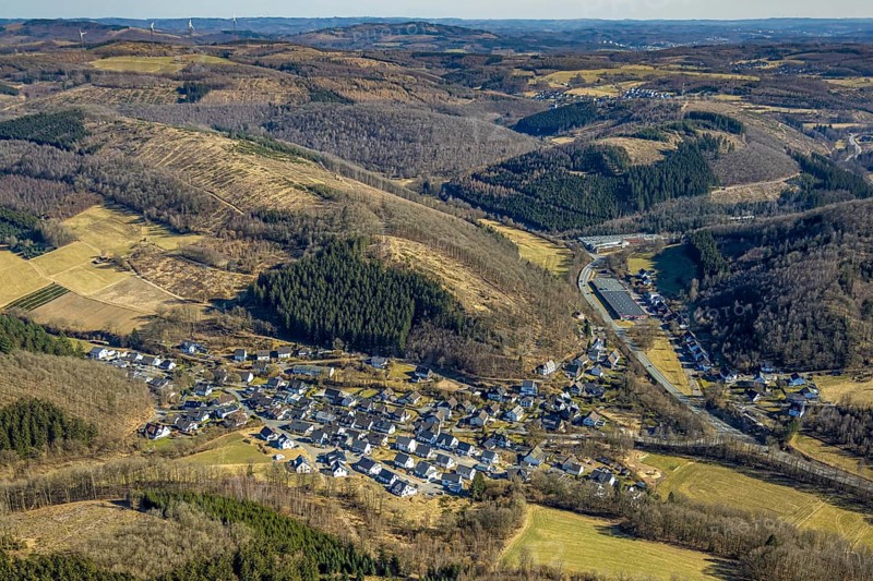 Aerial view, residential area, view of Stachelau district, forest area with forest damage and hilly landscape, on the right the furniture store Heinrich Bald GmbH, Stachelau, Olpe, Sauerland, North Rhine-Westphalia, Germany, DE, Europe, property tax, hilly landscape, real estate, aerial view, aerial photography, aerial photography, overview, bird's eye view, forest, forest damage, residential complex, living and living, residential area, residential quality, residential neighbourhood, housing estate, residential area, birds-eyes view, overview