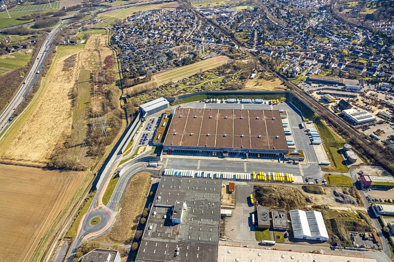 Aerial view, Amazon logistics centre, KGV allotment garden association Mellmausland with circular arrangement in the district of Rüdinghausen, Witten, Ruhr area, North Rhine-Westphalia, Germany, DE, Europe, community garden, KGV, allotment garden, allotment garden site, allotment garden association, allotment gardener association, allotment garden colony, logistics, logistics service, logistics service provider, logistics centre, aerial view, aerial photography, aerial photography, location, allotment garden, transport service, overview, bird's-eye view, overview
