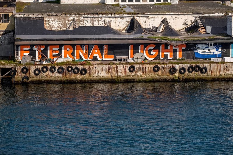 Street Art Eternal Light Eternal Night, in the harbour, Vardø, Finnmark, Norway, Scandinavia, Europe, adventure travel, tourism, graffiti eternal light eternal night, Hurtigruten, Hurtigruten voyage, cruise, NOR, travel, destination, sea voyage, sightseeing, tourism, Norwegian, Scandinavian, touristic