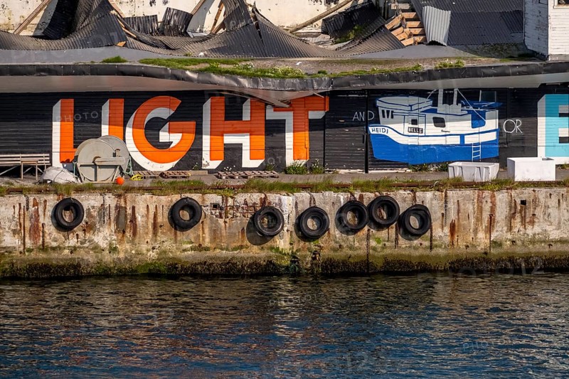 Street Art Eternal Light Eternal Night, in the harbour, Vardø, Finnmark, Norway, Scandinavia, Europe, adventure travel, tourism, graffiti eternal light eternal night, graphic Heidi Schiff, Hurtigruten, Hurtigrutenreise, cruise, NOR, travel, destination, sea voyage, sightseeing, tourism, Norwegian, Scandinavian, touristic