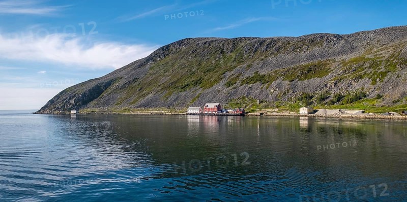 Foldalbruket kystkultursenter, museum, Norwegian house in red colours, jetty, mountainside, Kjøllefjord, Finnmark, Norway, Scandinavia, Europe, adventure travel, mountains, fjord, Foldalbruket Coastal Cultural Centre, tourism, wooden house, Hurtigruten, Hurtigruten trip, Kjøllefjord, cruise, coast, NOR, panorama, journey, destination, sea trip, sightseeing, tourism, Norwegian, red facade, Scandinavian, touristic, white windows