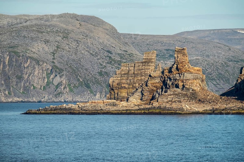 Finnkjerka rock formation, Kjøllefjord, Finnmark, Norway, Scandinavia, Europe, adventure trip, Finnkirka, fjord, tourism, Hurtigruten, Hurtigruten trip, Church of the Finns, Kjøllefjord, cliff, cruise, legends, NOR, natural monument, Sami sacrificial site, journey, destination, sea trip, sightseeing, tourism, Norwegian, Scandinavian, touristic